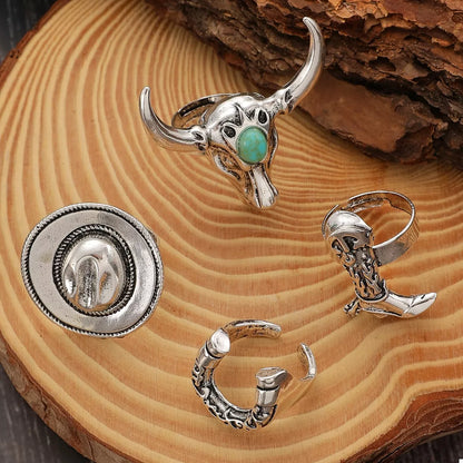 Silver western jewelry set with turquoise stone on a wooden surface