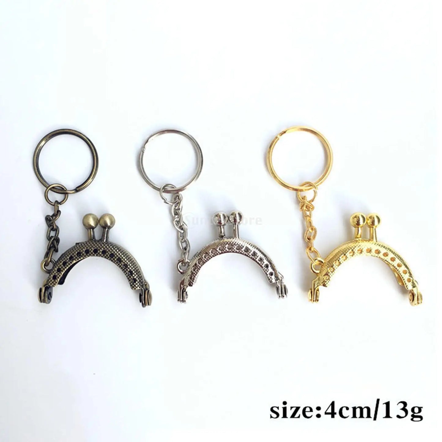 Three small purse clasps in antique bronze, silver, and gold finishes, displayed side-by-side on a white background with a size and weight text overlay in the bottom right corner. 
