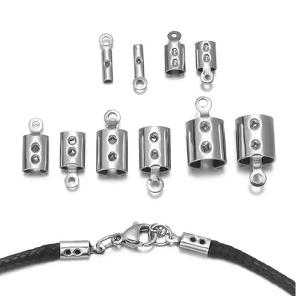 Nine silver-toned metal cable tie ends with loop attachments are arranged on a white background, with a close-up of one end clamped onto a black braided cord at the bottom.