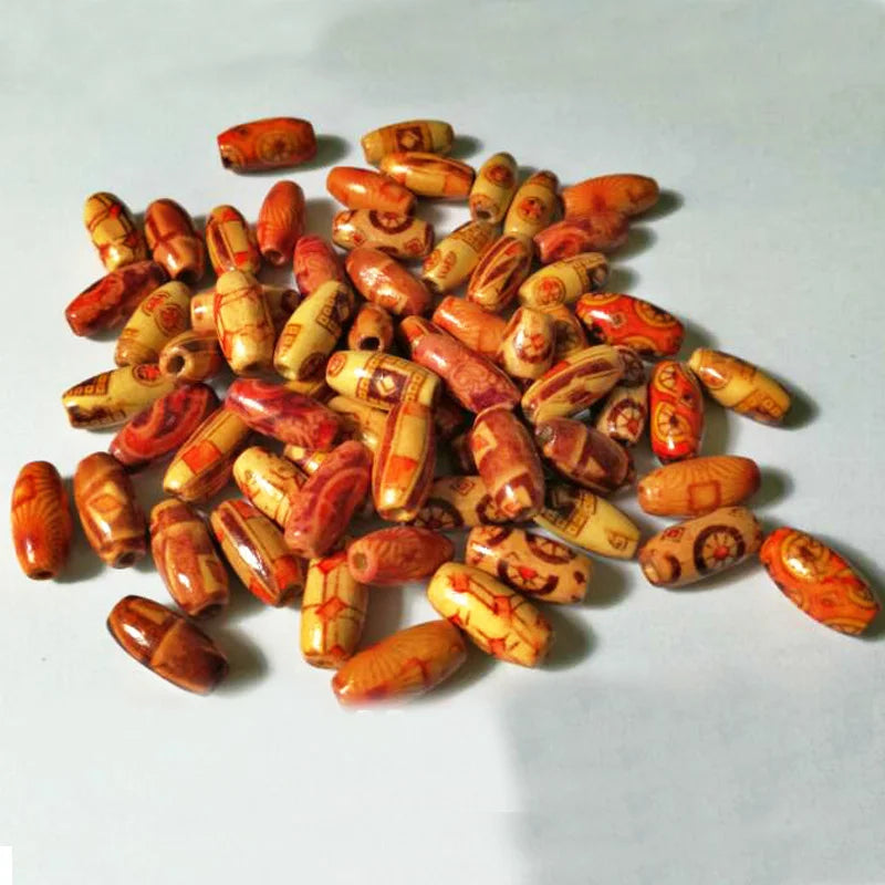 Collection of orange and brown beads on a light gray background