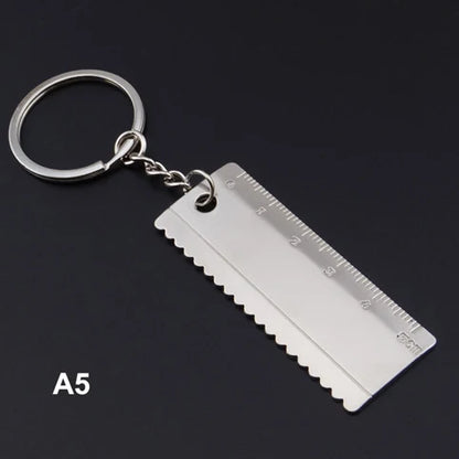 Metal ruler keychain on a black background