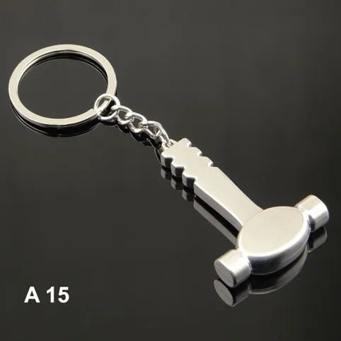 Metal keychain shaped like a bottle opener on a black background