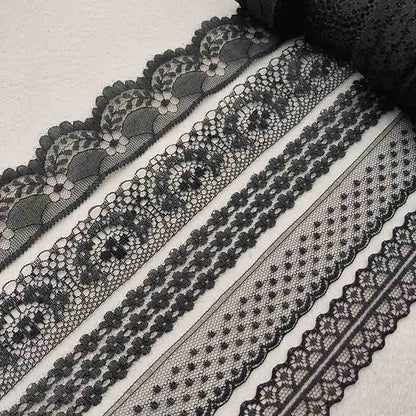 Collection of black lace trims on a light background