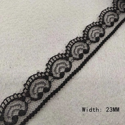 Black lace trim on a light gray background with width measurement '23MM'.