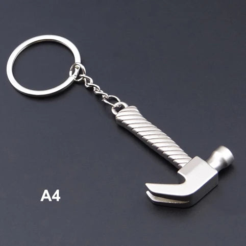 Metal hammer keychain on a dark background