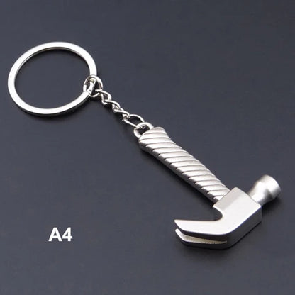 Metal hammer keychain on a dark background