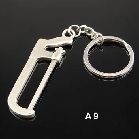 Silver monkey wrench keychain on a black background