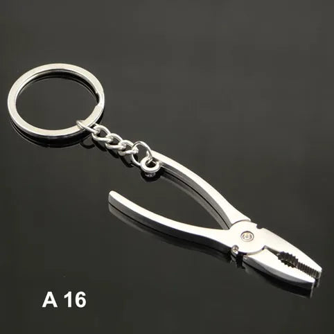 Metal pliers keychain on a black background