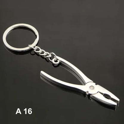 Metal pliers keychain on a black background