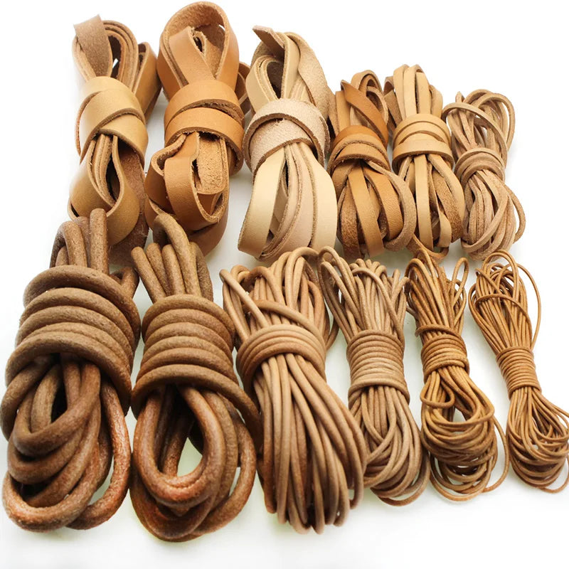 A set of assorted leather or leather corduroy rope ties in various widths and shades of brown, arranged in bundles on a white background.