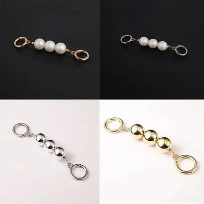 Four-panel product photo of a small keychain or bag charm with pearl-like white beads and polished metallic spheres/rings, shown in black, white, and gold-tone variants.