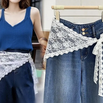 Woman wearing a blue top with lace trim jeans, close-up of jeans with lace trim.