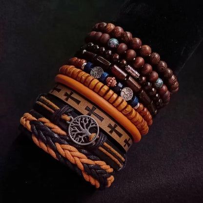 Multiple bracelets with wooden beads and braided designs on a dark background