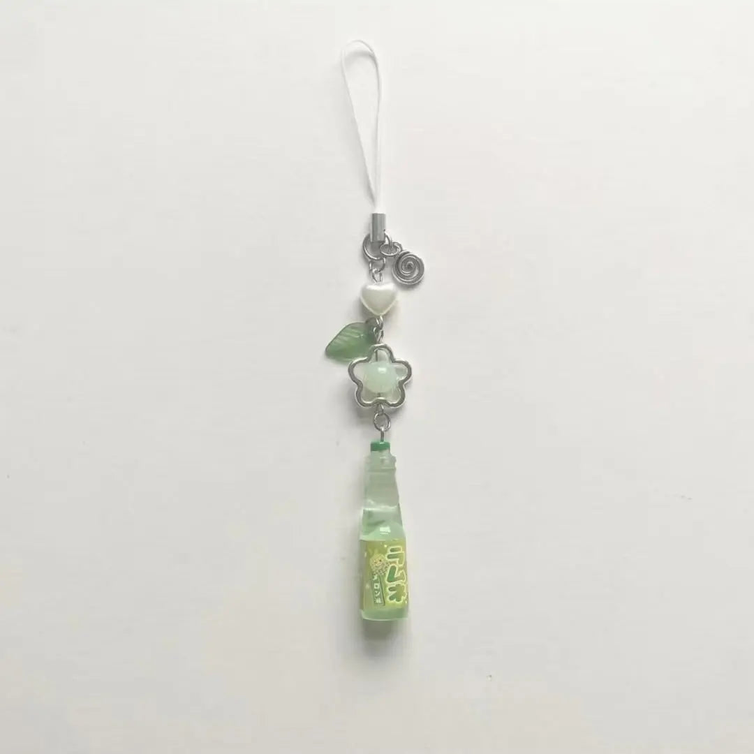 Green pendant charm on a white background