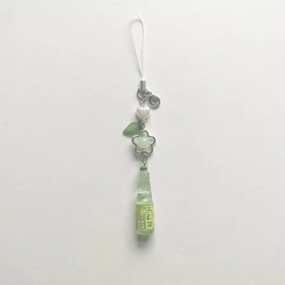 Green pendant charm on a white background