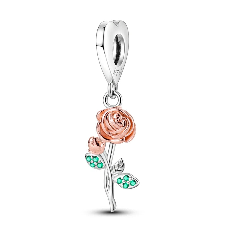 Rose-shaped pendant with silver and rose gold finish on a white background