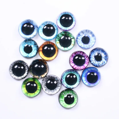 A group of round novelty costume or craft eyes with realistic black pupils and colorful irises in blue, green, purple, orange, and silver, arranged on a plain white background.