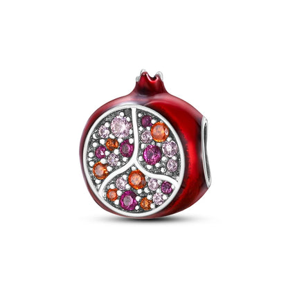 Red charm with a peace symbol design featuring colorful crystals on a white background