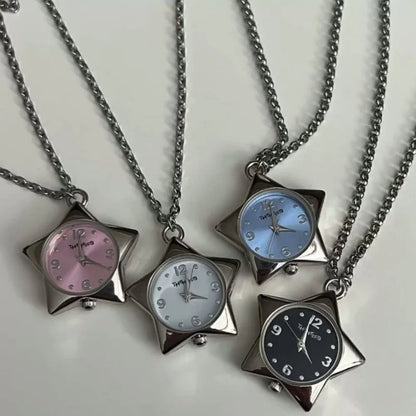 Star-shaped watch pendants on chains with different colored faces on a white background