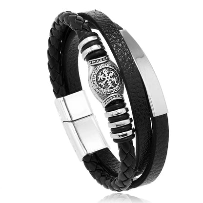 Black braided leather bracelet with silver metal accents on a white background