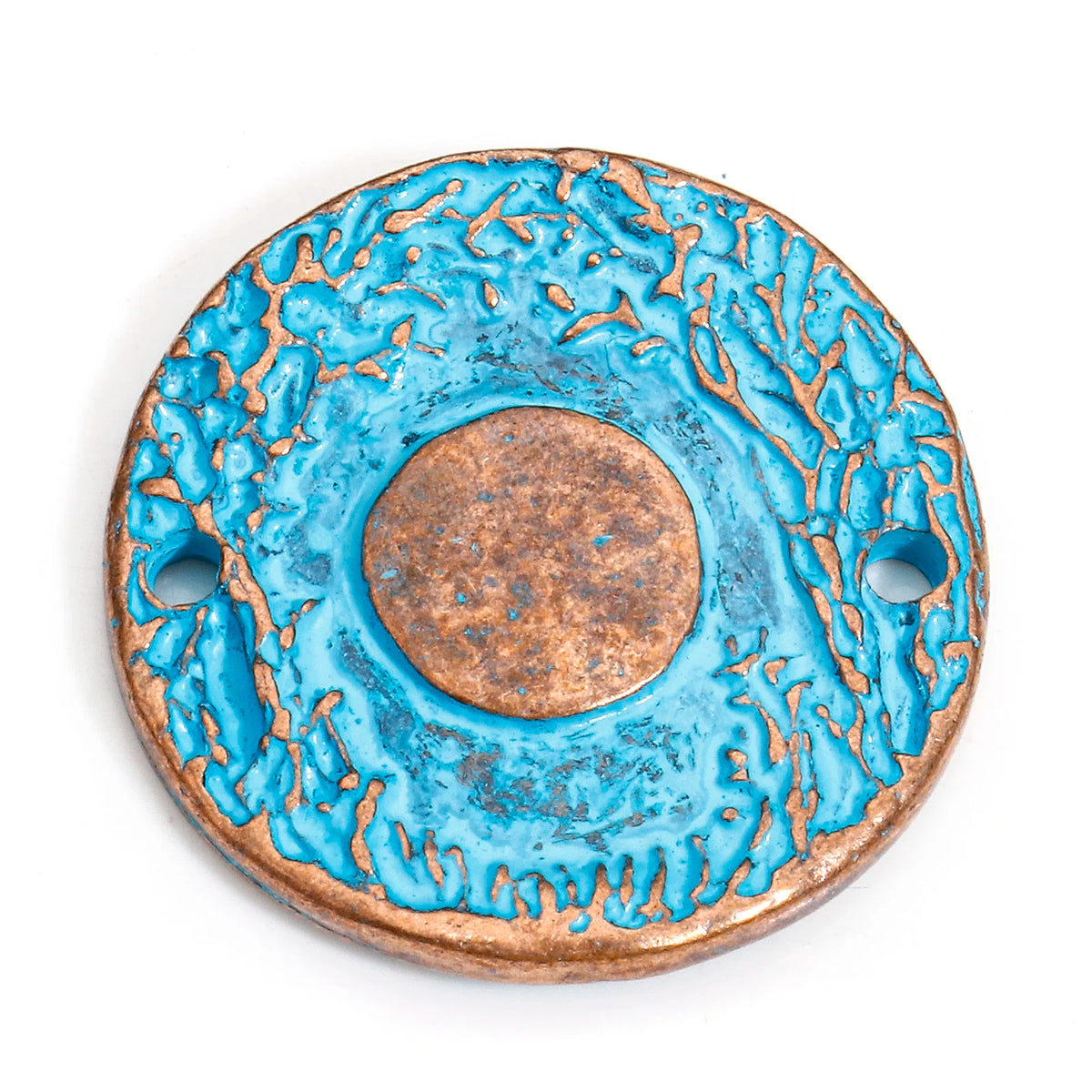 A round ceramic pendant with a textured turquoise blue glaze and a central copper-toned medallion, featuring two side holes, shown on a white background.
