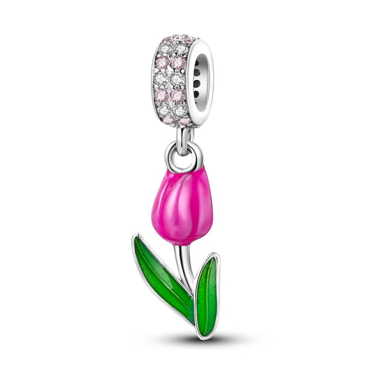 Jewelry charm with pink tulip design on a white background