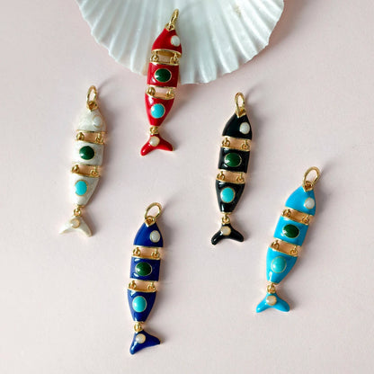 Colorful fish-shaped earrings on a white background