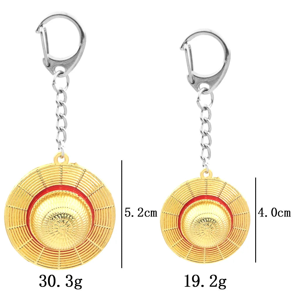 Gold keychain with red center and silver clasp, shown with measurements on a white background.