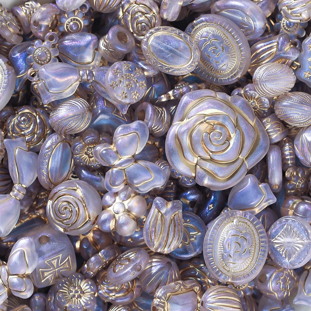 Close-up of decorative buttons with floral and geometric designs in gold and silver.