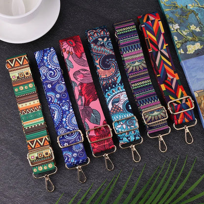 Colorful patterned straps with metal clasps on a dark surface