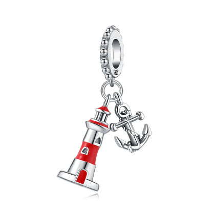 Pendant charm with lighthouse and anchor design on a white background