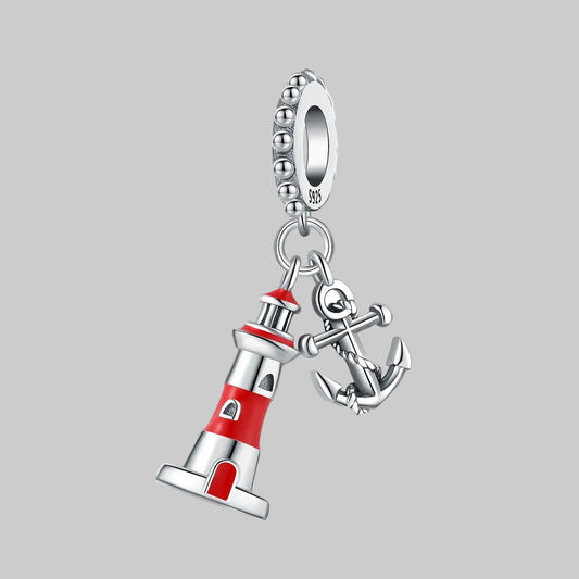 Pendant charm with lighthouse and anchor design on a white background