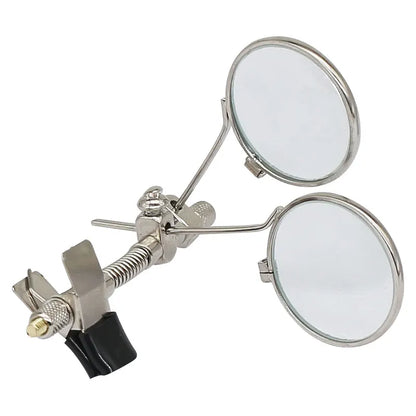Metal magnifying glass with two round lenses on a white background
