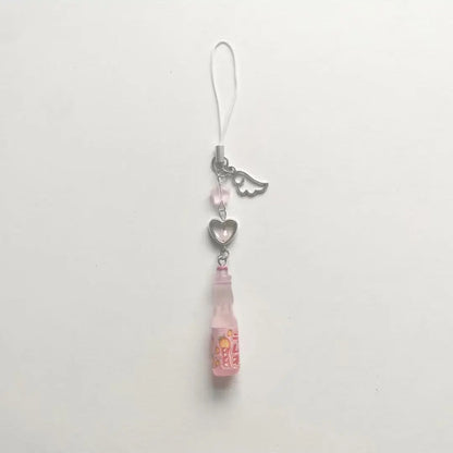 Phone charm with pink pendant and heart-shaped tag on a white background