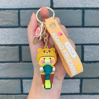 Keychain with a character and 'Kakao Friends' tag held against a brick wall.