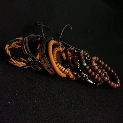 Set of braided and beaded bracelets on a black background