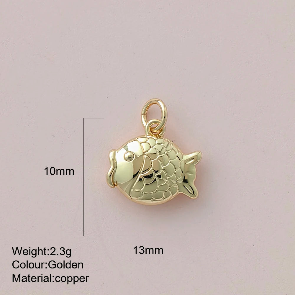 Gold fish pendant with measurements and material details on a light pink background
