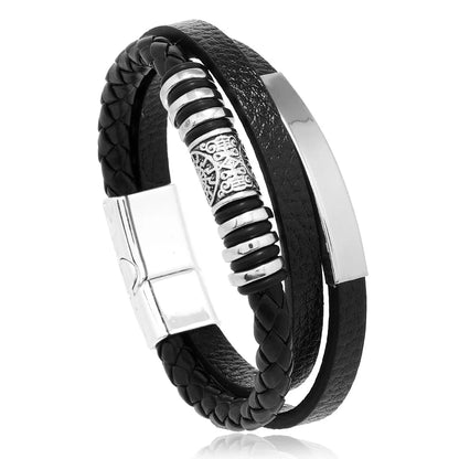 Black braided leather bracelet with silver metal accents on a white background