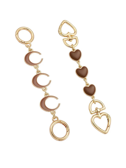 Gold and brown strap extension on a white background