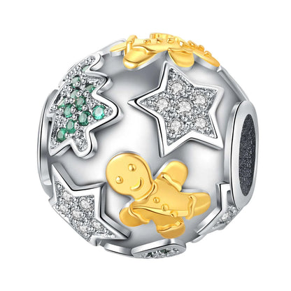 Jewelry charm with gold gingerbread bear, silver stars, and green gemstones on a white background