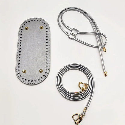 Gray leather patch with gold hardware on a white background