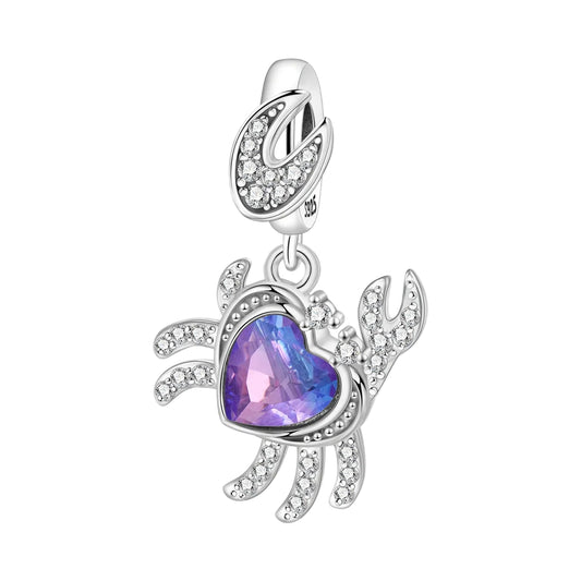 Silver charm with a purple heart and crab design on a white background