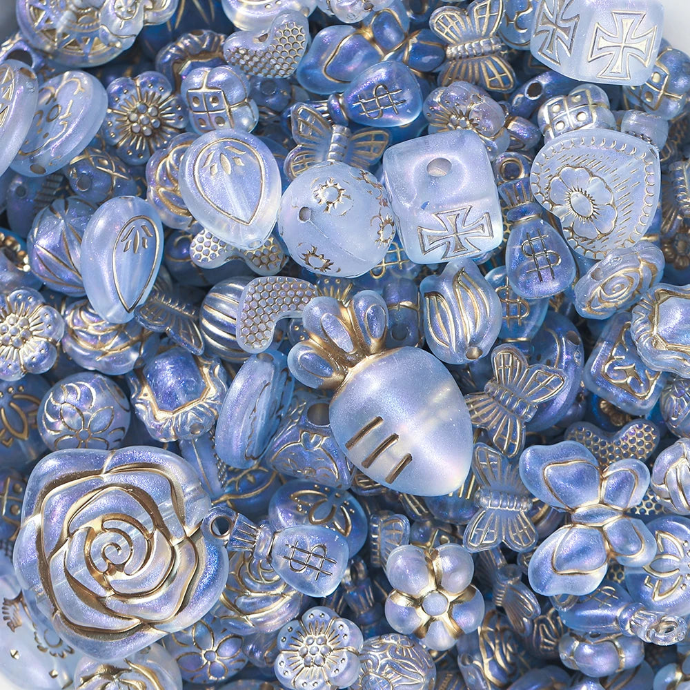 Collection of blue and gold decorative beads and charms.