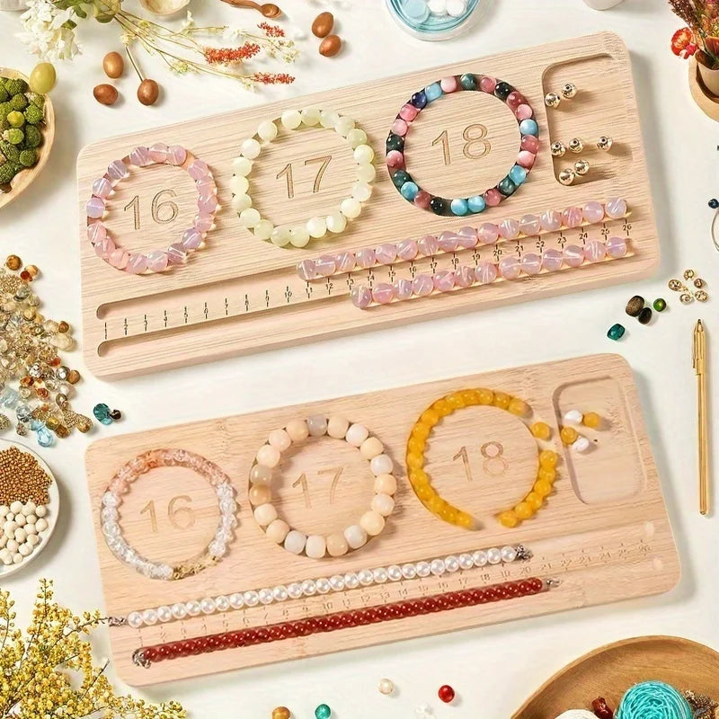 Two engraved wooden bead boards jewelry-making trays arranged on a white surface, displaying colorful beaded bracelets, beads, and small jewelry components. The trays are labeled with numbers 16, 17, and 18, surrounded by decorative dried flowers, beads, and small craft supplies.