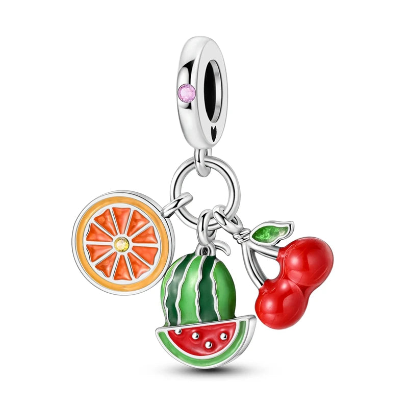 Fruit-themed charm with orange, watermelon, and cherry on a white background