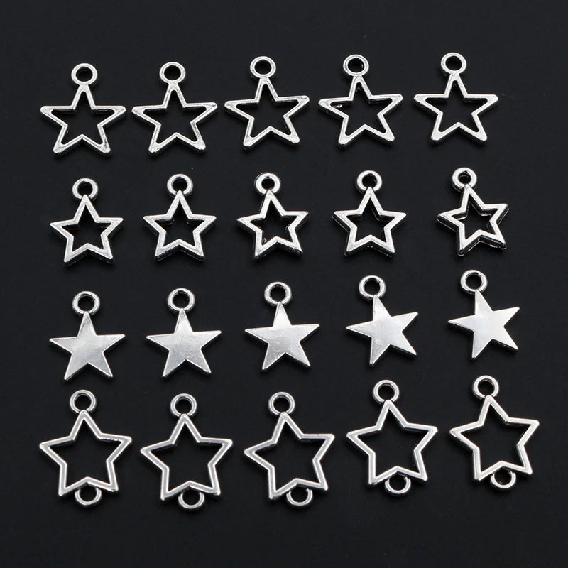 Collection of silver star-shaped charms on a black background