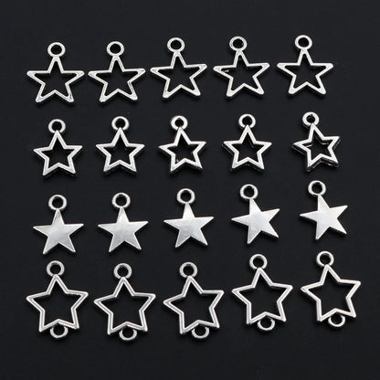 Collection of silver star-shaped charms on a black background