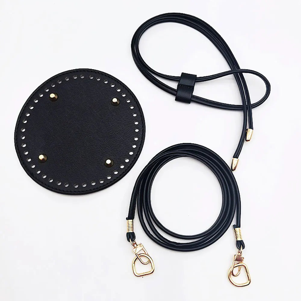 Black leather strap with gold hardware on a white background