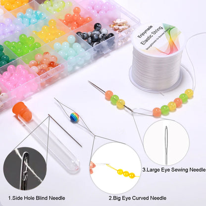 Assorted sewing needles and colorful beads with close-up details on a white background.