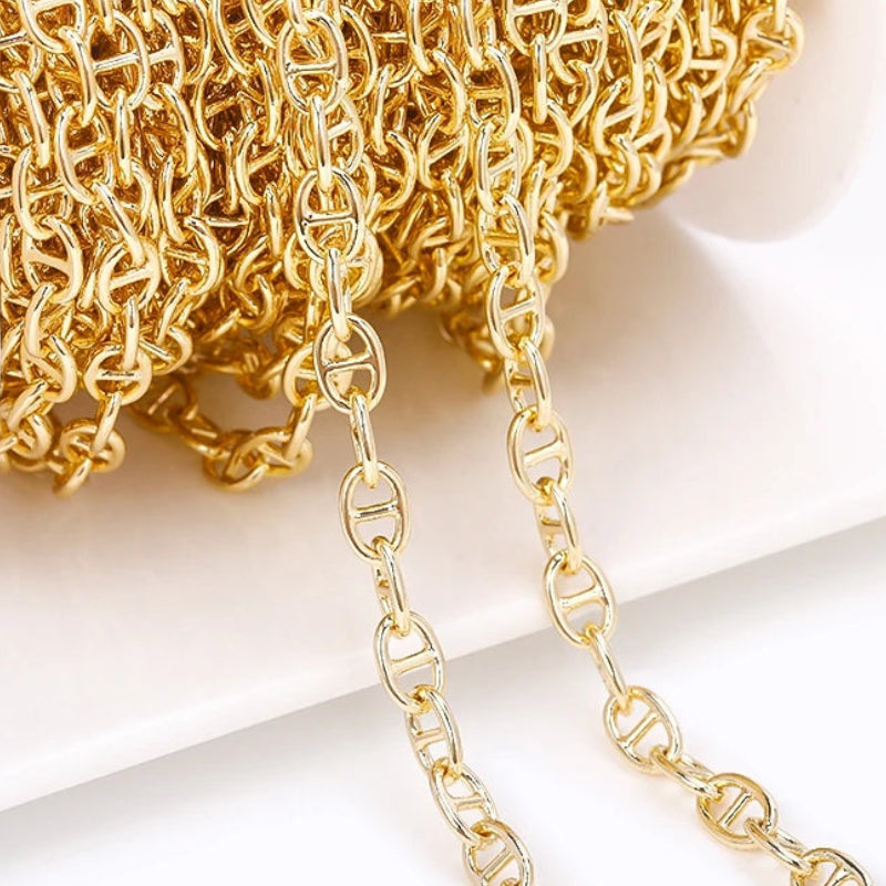 Gold chain on a light background